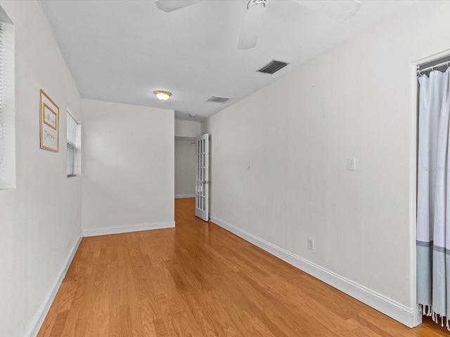 unfurnished room featuring light hardwood / wood-style floors and ceiling fan