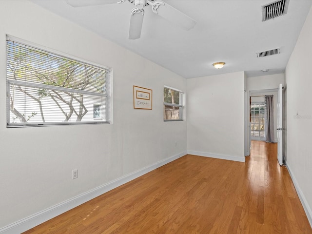 unfurnished room with ceiling fan and light hardwood / wood-style floors