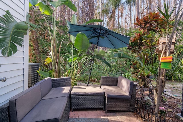 view of patio with cooling unit and outdoor lounge area