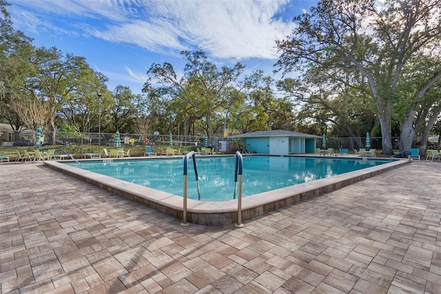 view of swimming pool featuring a patio area