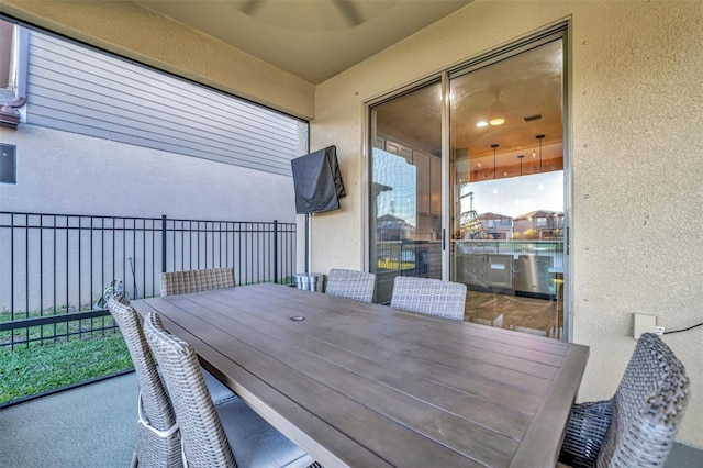 view of patio featuring a balcony