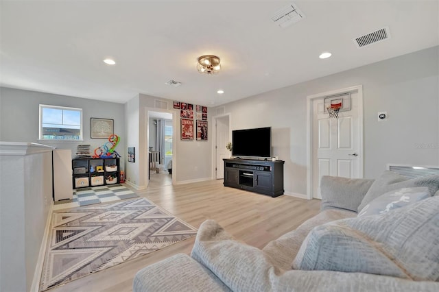 living room with light hardwood / wood-style floors