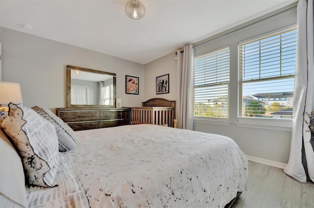 bedroom with light hardwood / wood-style flooring