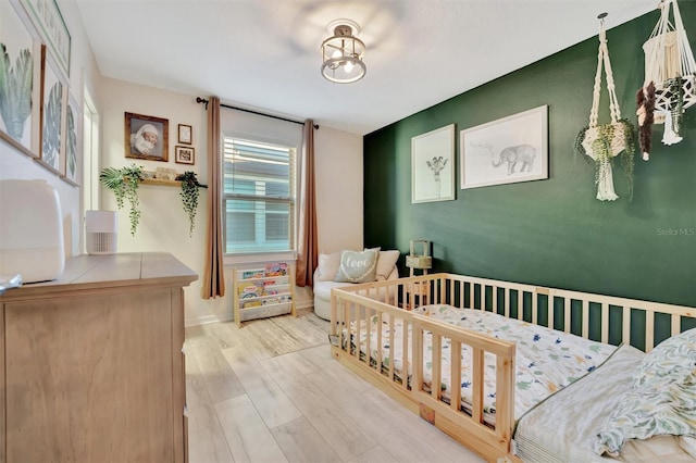 bedroom featuring light hardwood / wood-style floors