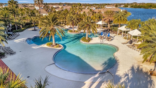 view of swimming pool with a gazebo, a patio, and a water view