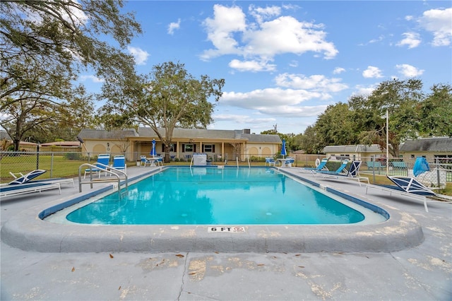 view of swimming pool featuring a patio