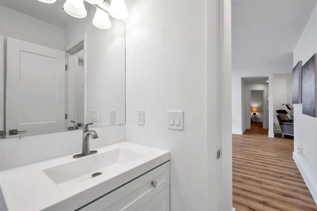 bathroom with vanity and wood-type flooring