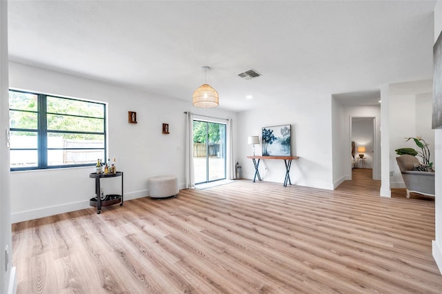 unfurnished room with light hardwood / wood-style floors