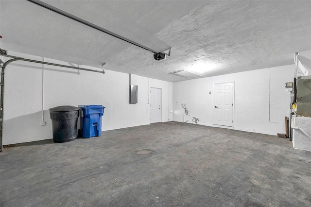 garage featuring a garage door opener and electric panel