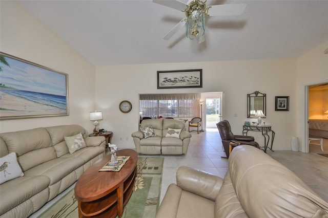 living area featuring light tile patterned floors, vaulted ceiling, and a ceiling fan