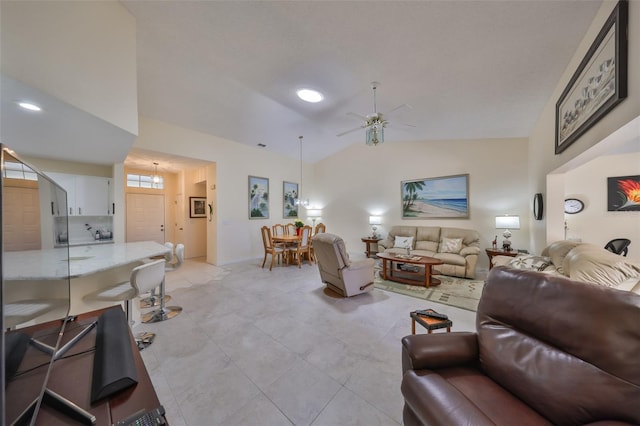 living room with ceiling fan, high vaulted ceiling, and light tile patterned floors