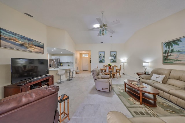 living room featuring high vaulted ceiling and ceiling fan