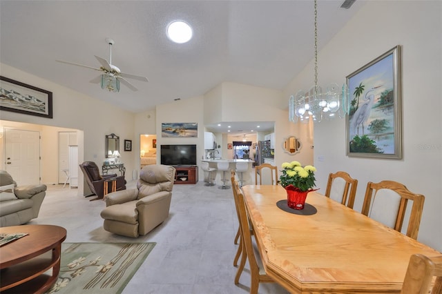 dining room featuring ceiling fan, high vaulted ceiling, and light tile patterned flooring