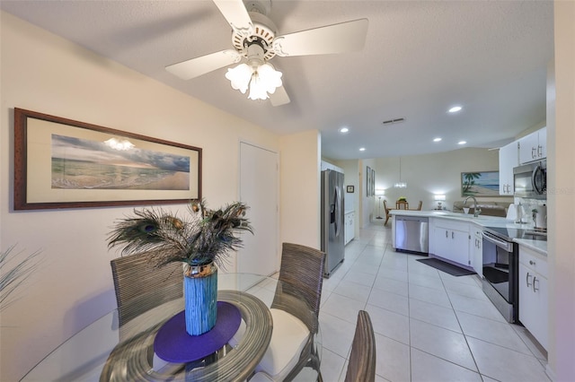 dining area featuring a ceiling fan, recessed lighting, and light tile patterned flooring