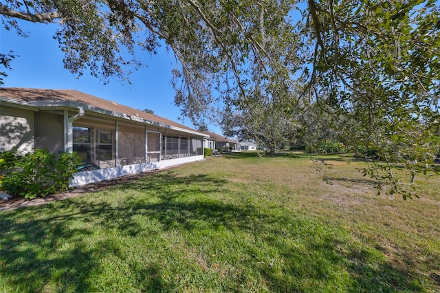 view of yard with a sunroom