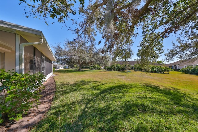 view of yard with a sunroom