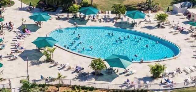 view of pool with fence and a patio