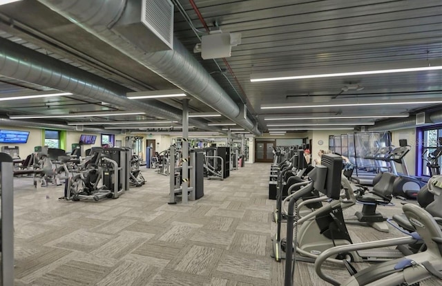 exercise room with carpet flooring