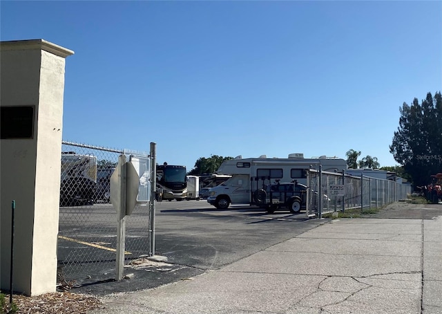 uncovered parking lot with fence