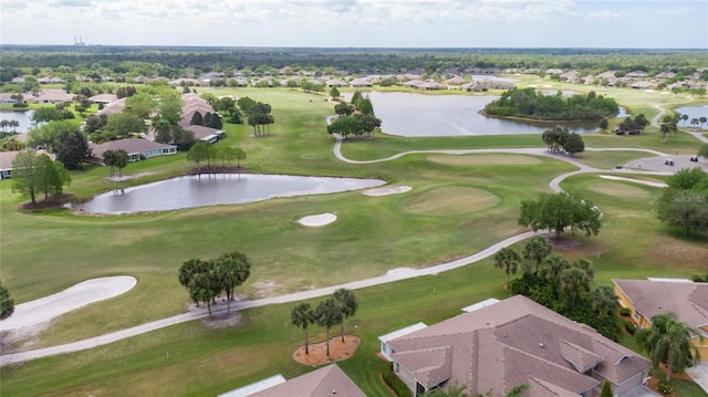 aerial view with view of golf course and a water view