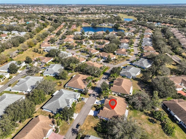 aerial view featuring a water view and a residential view