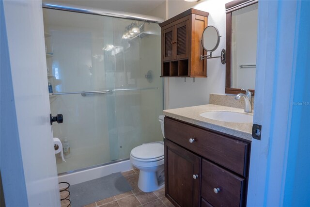1433 Pine Glen Pl Unit G2, Tarpon Springs, FL 34688 - full bath featuring tile patterned floors, a shower stall, toilet, and vanity
