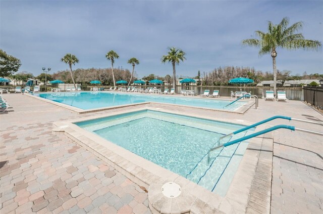 1433 Pine Glen Pl Unit G2, Tarpon Springs, FL 34688 - pool with a patio and fence
