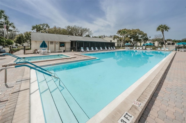 1433 Pine Glen Pl Unit G2, Tarpon Springs, FL 34688 - community pool featuring a patio and fence