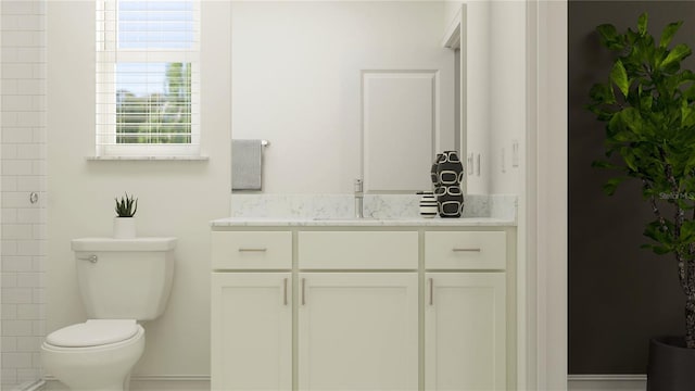 bathroom featuring vanity and toilet