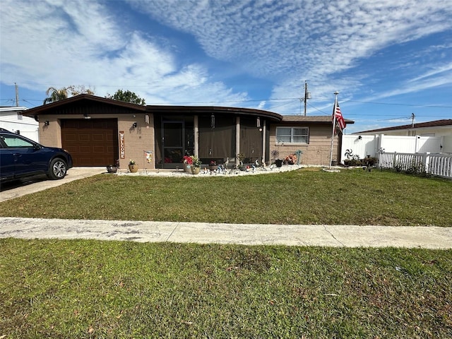 view of front of house with a garage and a front yard