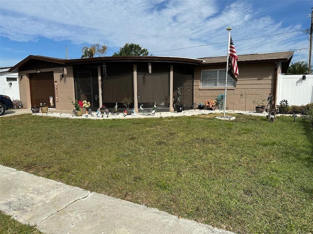 view of front facade featuring a garage and a front lawn