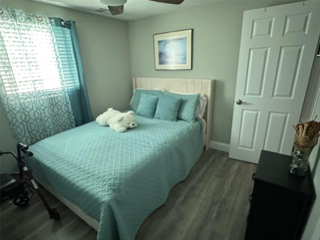 bedroom featuring hardwood / wood-style floors and ceiling fan