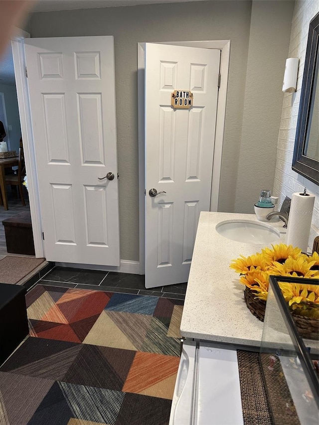 bathroom featuring vanity and tile patterned flooring