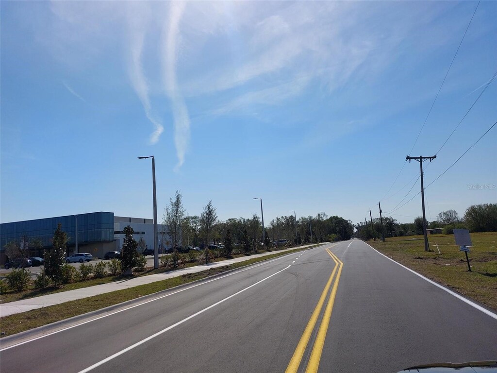 2616 Tarupa Ln, Ruskin, FL 33570 - view of road with sidewalks and street lights