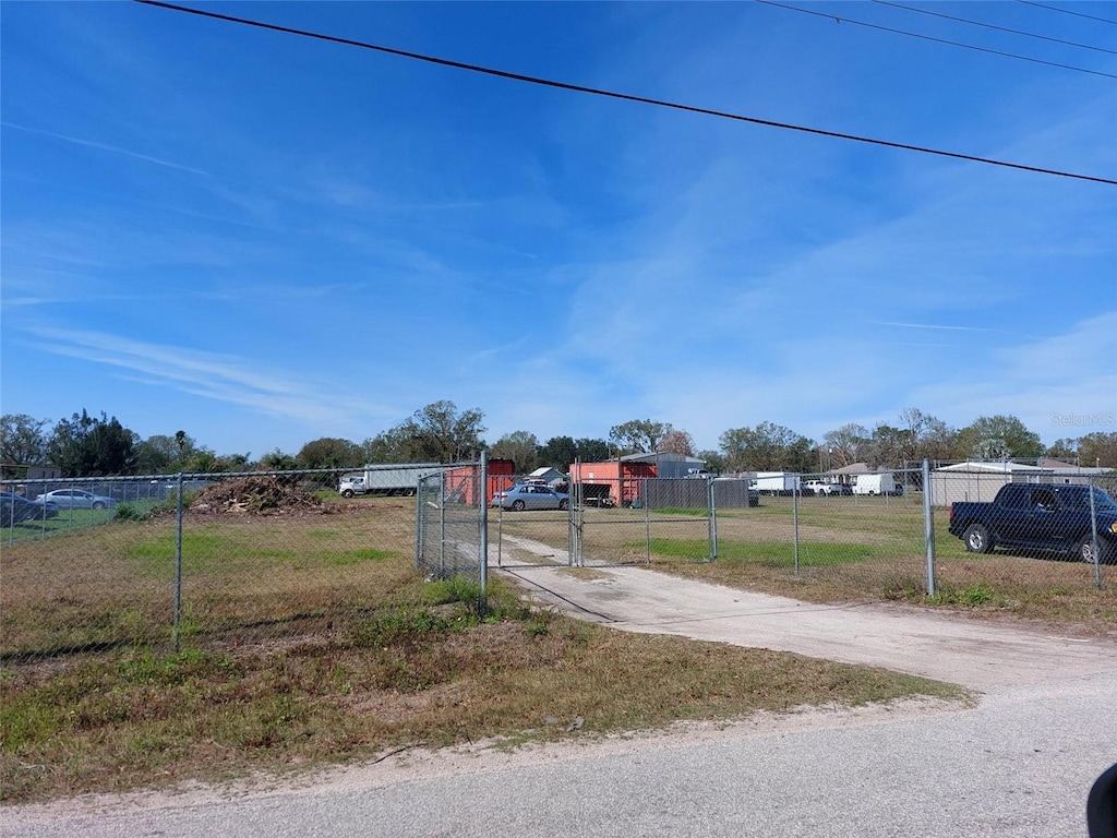 2616 Tarupa Ln, Ruskin, FL 33570 - view of street with driveway, a gated entry, and a gate