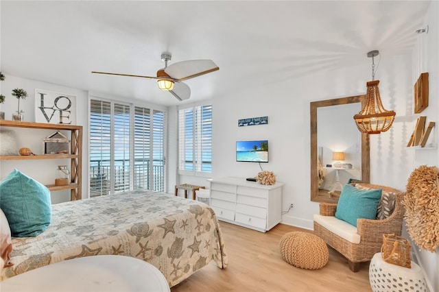 bedroom with ceiling fan and light wood-type flooring