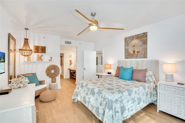 bedroom with wood-type flooring and ceiling fan