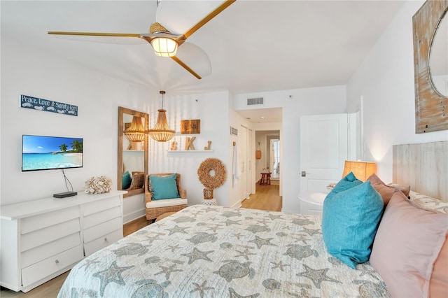 bedroom featuring ceiling fan and light hardwood / wood-style floors