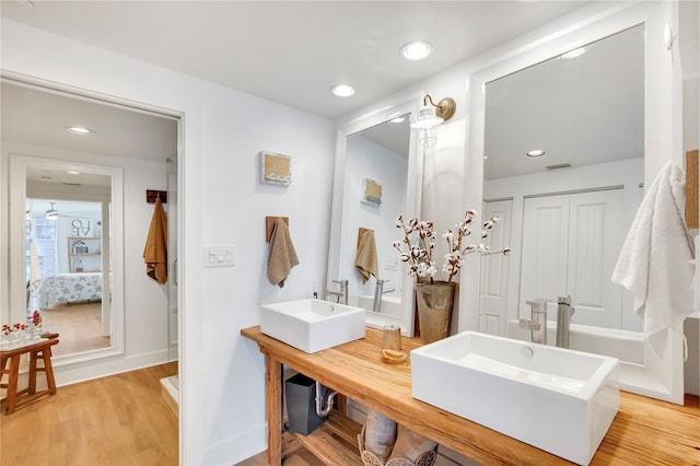 bathroom featuring vanity and hardwood / wood-style floors