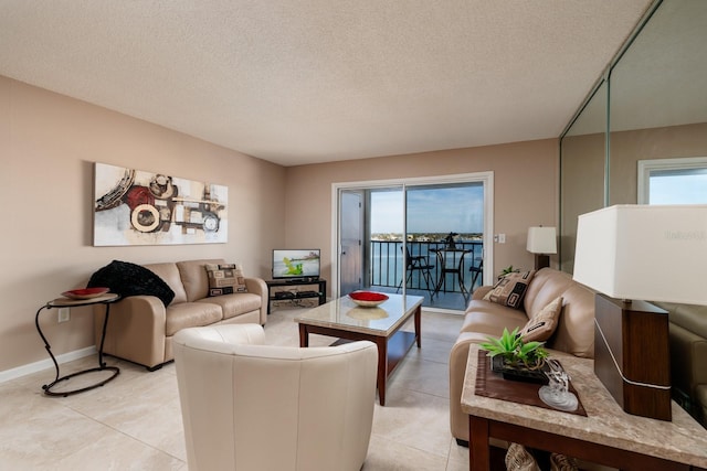 tiled living room with a textured ceiling