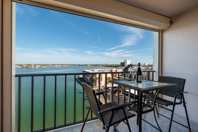 balcony featuring a water view