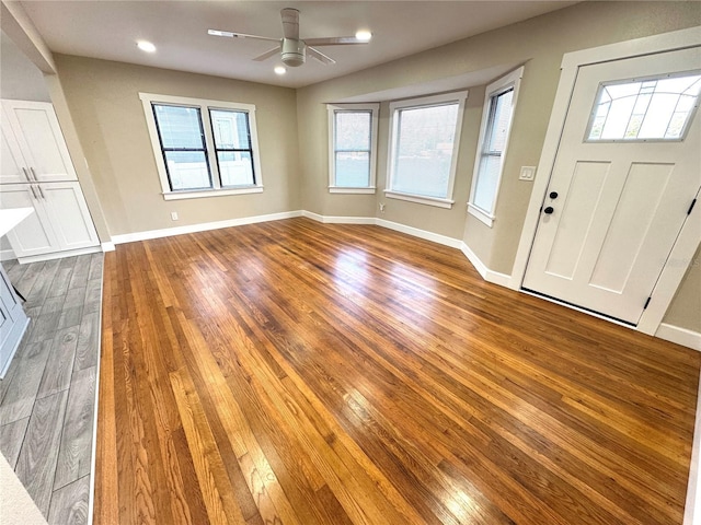 foyer entrance featuring hardwood / wood-style floors and ceiling fan