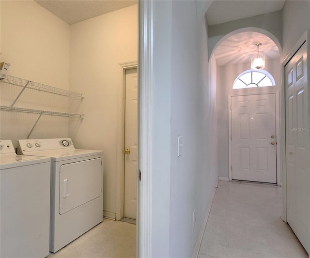 laundry room with washing machine and clothes dryer