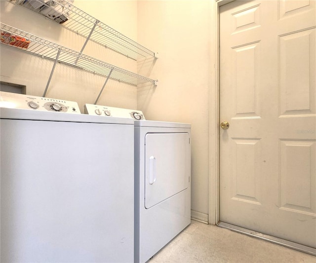 laundry area with washing machine and clothes dryer