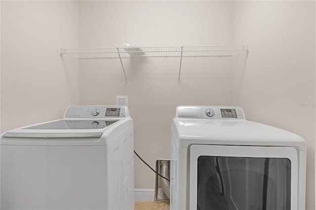 washroom with washing machine and dryer