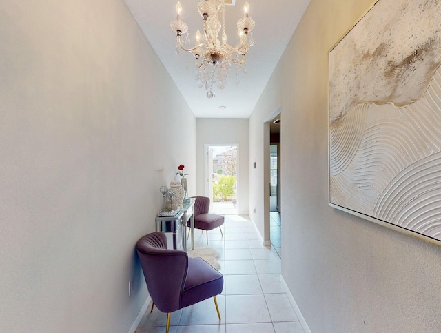 hallway featuring light tile patterned floors and a notable chandelier