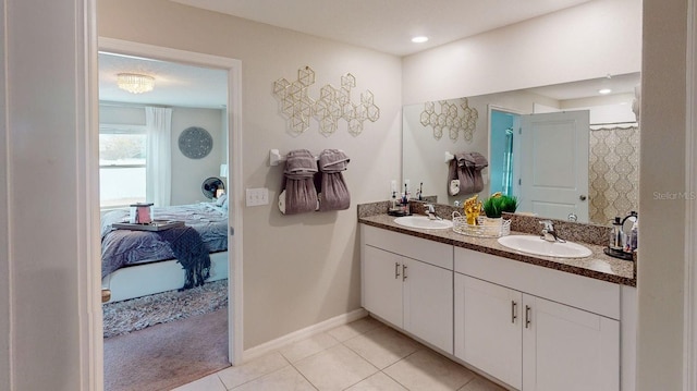 bathroom featuring tile patterned floors and vanity