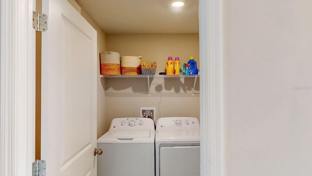 laundry area with independent washer and dryer