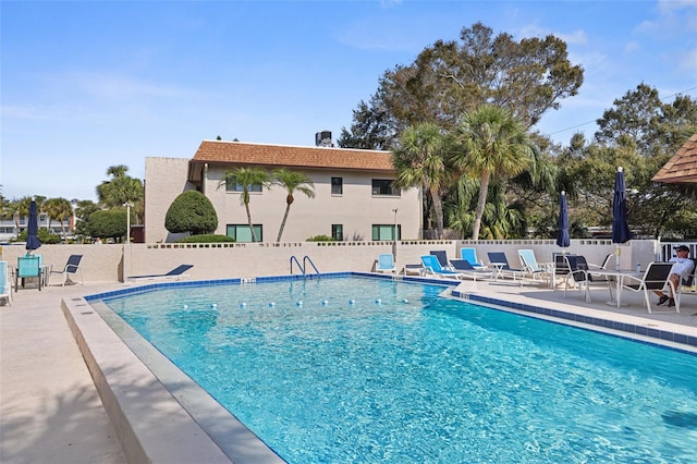 view of swimming pool featuring a patio