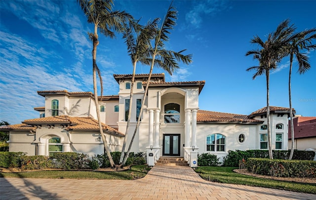 mediterranean / spanish-style house featuring french doors